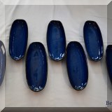 K21. 7 Blue ceramic corn cradles. - $18